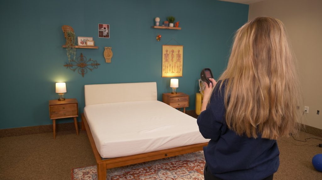 Julia Forbes testing temperature dissipation on a mattress